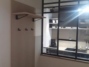 a room with a window with a shelf and a window at Lieblingsplatz am Kurpark in Brilon +3 photos