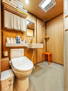 a bathroom with a toilet and a sink at Pipa Hotel Datong in Datong