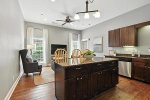 a kitchen with a large island in the middle at NEW LISTING The Townie Retreat - Walk to Stadium in Athens