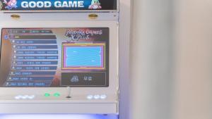 a board with a video game on the wall at Taean Lily Pension in Taean
