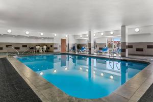 a large pool with blue water in a hotel room at Comfort Suites Denver Tech Center in Centennial
