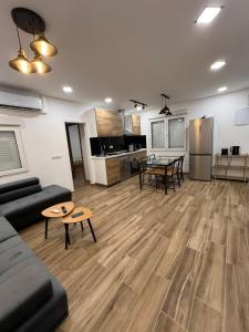a living room with a couch and a table at Modern apartment 2 Barcelona in Santa Coloma de Gramanet