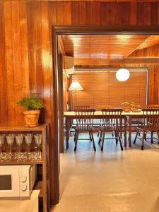 a dining room with a table and wooden walls at SLOW GWANGAN hotel in Kwangan-dong