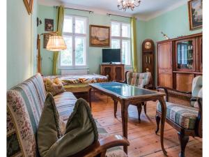 a living room with a couch and a table at Ferienwohnungen Romantika in Potsdam