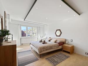 Postel nebo postele na pokoji v ubytování Casa Alps Sion - Swiss Alps