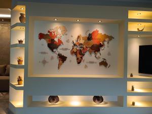 a map of the world on a wall at Dimitra's house in Aridaia
