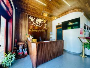 a restaurant with a reception desk in a room at Daisy's Villa TamCoc in Vũ Lâm +49 photos