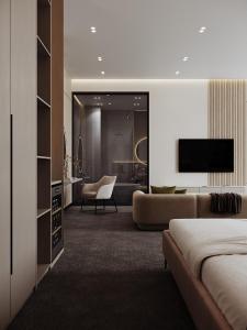 een slaapkamer met een bed en een woonkamer bij Grand Dior in Tasjkent