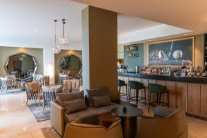 a lobby with a couch and a bar at Saint Sofia Golf Club, Hotel and SPA in Robertowo +49 photos