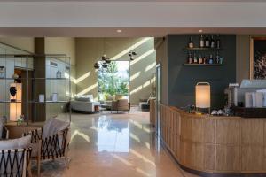 a lobby with a bar and a living room at Saint Sofia Golf Club, Hotel and SPA in Robertowo