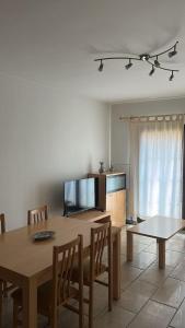 a kitchen with a table and chairs and a dining room at Apartamento Camarena de La Sierra in Camarena de la Sierra