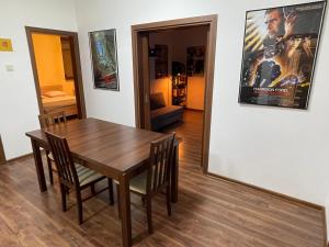 a dining room with a table and a movie poster at Cinema house at Sofia center in Sofia +25 photos