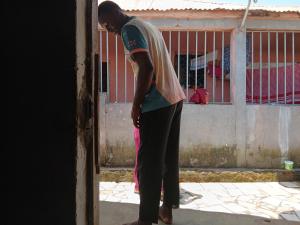 a man standing in the doorway of a building at Mohamedu in Bissau