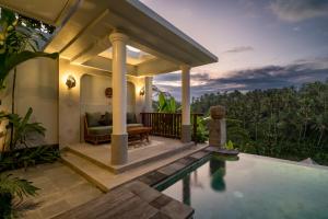 a villa with a swimming pool and a house at Sanggraloka Ubud in Ubud +41 photos