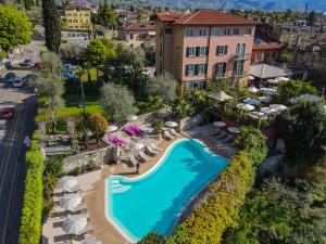 an aerial view of a resort with a swimming pool at Villa Miravalle - Boutique Hotel in Riva del Garda
