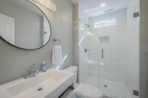 a white bathroom with a sink and a shower at The Complex on Bobbin Mills in Athens +71 photos