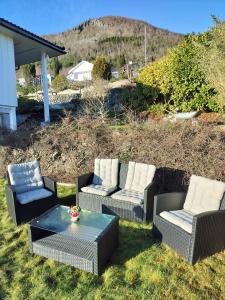 a group of chairs and a table on a yard at Prekestolen, Pulpit Rock in Strand