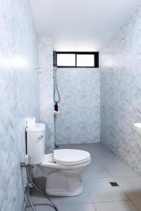 a white bathroom with a toilet and a sink at X Yellow Place Sukhumvit Soi 2 BTS Nana - เยลโล เพลส สุขุมวิท ซอย 2 บีทีเอส นานา in Bang Kapi +56 photos