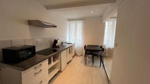 a kitchen with a sink and a counter top at Zen Studio Center Toulon in Toulon