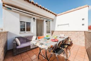 a patio with a table and a couch at Casa Las 4 Estaciones in Caudiel +63 photos