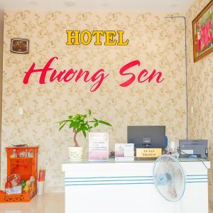 a hotel hiring sign on the wall of a room at Khách sạn Hương Sen Sa Đéc in Sa Ðéc