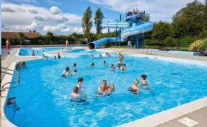 a group of people in a swimming pool at 27 Ivy Close in Mablethorpe