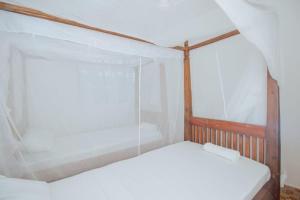 Postel nebo postele na pokoji v ubytování Coral haven watamu