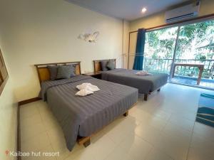 Postel nebo postele na pokoji v ubytování Kaibae Hut Resort