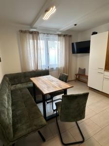 a living room with a table and a couch at Ferienwohnung Lang in Königsfeld