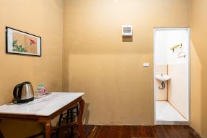 a bathroom with a counter and a sink and a toilet at X Rest Inn Yaowarat เรสอินน์ เยาวราช in Samphanthawong +53 photos