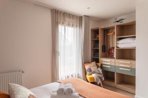 Ένα ή περισσότερα κρεβάτια σε δωμάτιο στο Villa Ty Laouen - Proche Plage