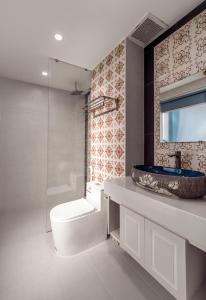 a bathroom with a toilet and a sink at ELC Boutique Hoi An Hotel in Hoi An