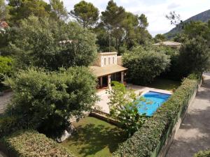 an aerial view of a house with a swimming pool at Nispero in Sa Pobla