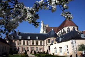 a large building with a tower on top of it at Le Champigny in Champigny-sur-Yonne