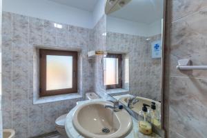 a bathroom with a sink and a toilet at Casa De Los Abuelos in Ortigosa del Monte +29 photos