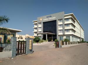 a building with a sign on the front of it at Hotel Suba Grand Dahej in Dahej