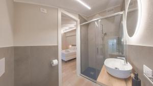 a bathroom with a toilet and a sink and a shower at LE Home Soave - Locazione Turistica in Soave