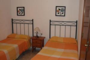 Postel nebo postele na pokoji v ubytování Hostal Alcázar