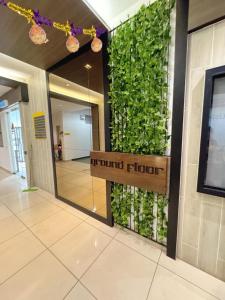 a sign in a building with a green wall at Kalista1 Seremban 2 in Seremban +50 photos