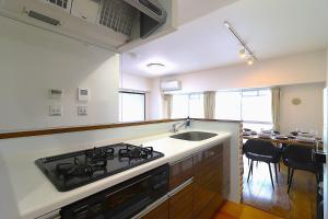 Kuchyň nebo kuchyňský kout v ubytování Cafune NAGOYA - Perfect for sightseeing in Nagoya and long-term stays! 3LDK with parking lot