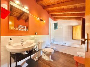 a bathroom with a sink and a toilet and a tub at Hotel Rural Villa Liquidámbar in Torrecilla en Cameros +82 photos