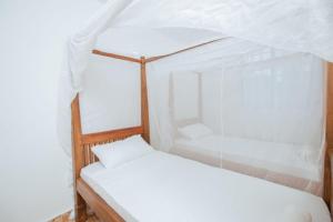 Postel nebo postele na pokoji v ubytování Coral haven watamu