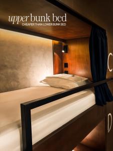 A bed or beds in a room at Yamato Hostel