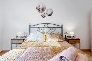 a bedroom with a large bed with two night stands at Canana De Vega in Flix