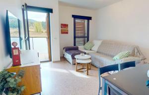 a living room with a couch and a table at Apartamento en Alcala de la Selva by Family Homes in Alcalá de la Selva