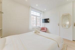 En eller flere senge i et værelse på Joli studio 20m2 cozy et équipé avec terrasse !