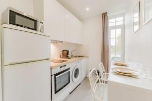 Køkken eller tekøkken på Joli studio 20m2 cozy et équipé avec terrasse !