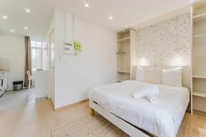 En eller flere senge i et værelse på Joli studio 20m2 cozy et équipé avec terrasse !