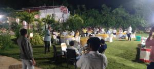 a group of people at an event in the grass at Sivarama garden resort 5star stay , swimming pool,8 BHK , bheemili beach road Bheemunipatam in Visakhapatnam +183 photos