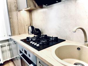 Kuchyň nebo kuchyňský kout v ubytování M&M Apartment IV SELF CHECK-IN + 4 fotografie